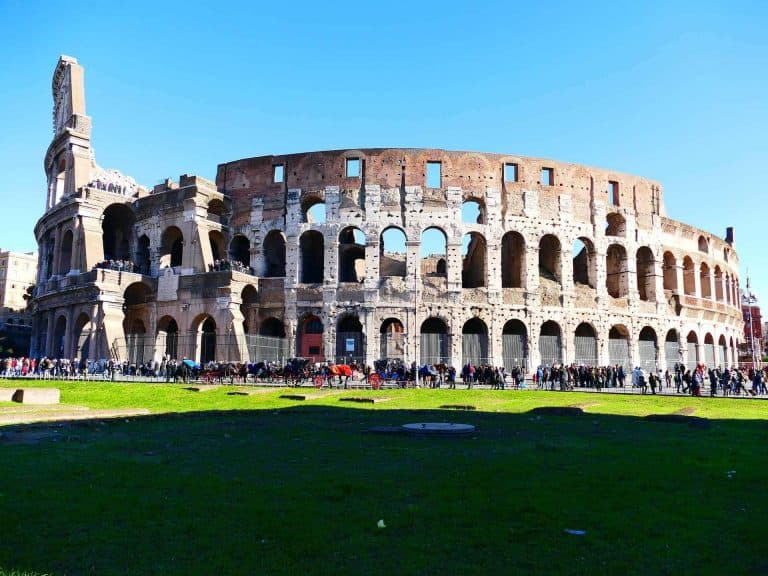 Colosseum in Rome with blue sky background.