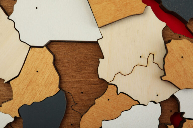 Close-up of wooden jigsaw puzzle pieces.